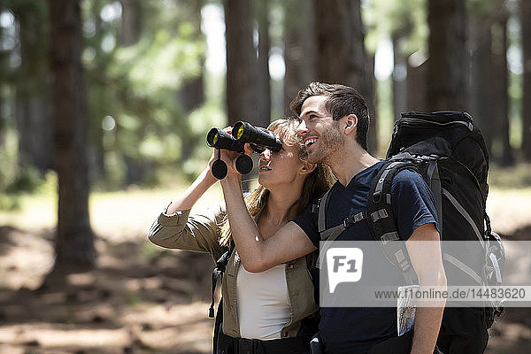 Young couple hiking in forest