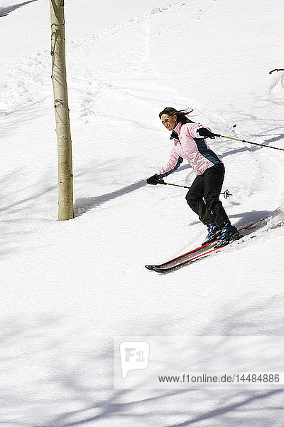 Young woman downhill skiing Dixie National Forest Utah Winter