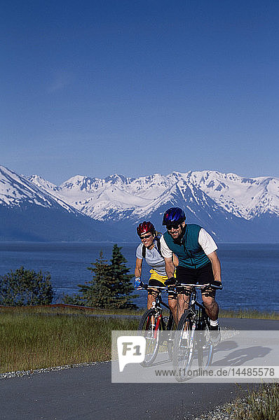 Couple Mountain Biking on Bird-Girdwood Trail SC Alaska