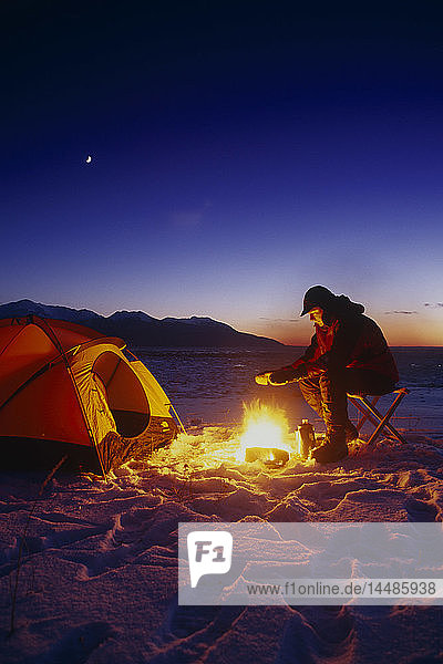 Man by Campfire & Tent Winter Chugach SP SC AK