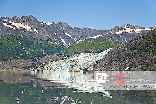 A Couple kayaking in Upper Shoup Bay Shoup Glacier background Shoup Bay State Marine Park Prince William Sound Alaska