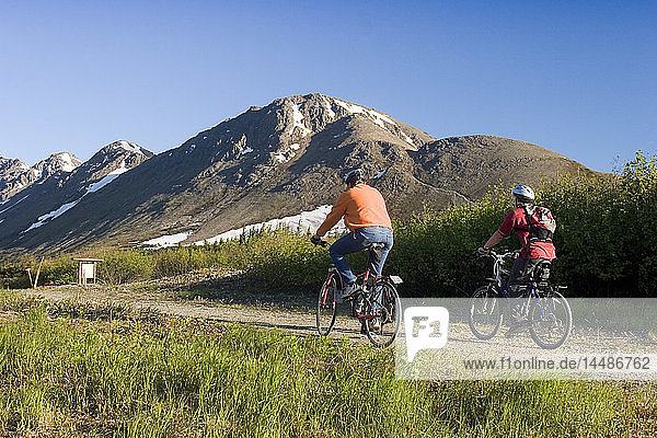 Mtn Bikers Riding on Power Line Pass Trail Alaska SC Chugach SP Glen Alps Summer