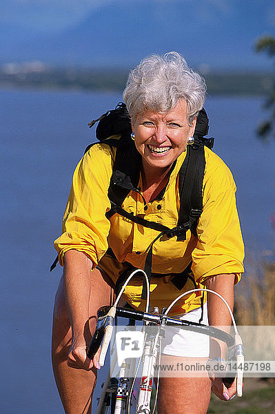 Portrait of Senior Woman on Bike Coastal Trail Southcentral Alaska