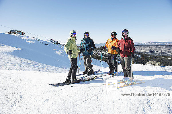 Friends gather at the top of Mt. Aurora Skiland for a day of downhill skiing near Cleary Summit north of Fairbanks  Alaska