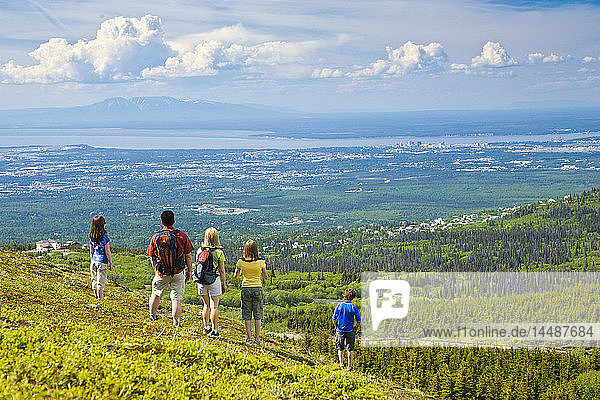 Family hiking in the Glen Alps area overlooking Anchorage Southcentral Alaska