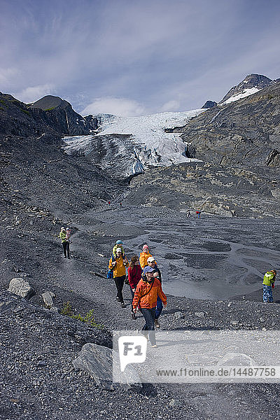 Families hiking on a path in front of the Worthington Glacier  Chugach National Forest  Southcentral  Alaska