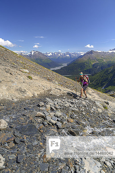 Woman hiking the Harding Icefield Trail in Kenai Fjords National Park near Seward  Kenai Peninsula  Southcentral Alaska  Summer  HDR