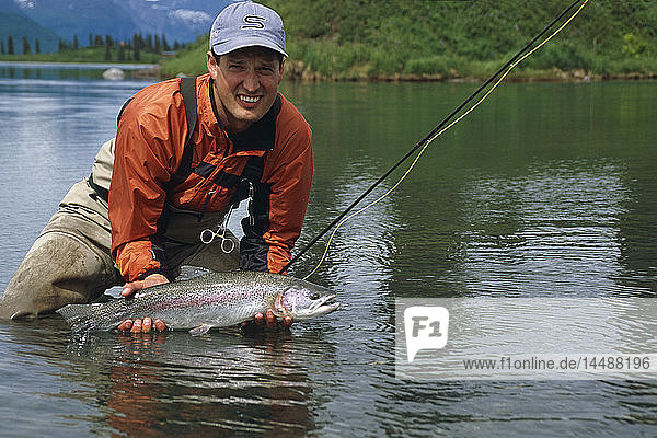 Flyfisherman Holding 27 Rainbow Trout Lake Creek AK SC Summer