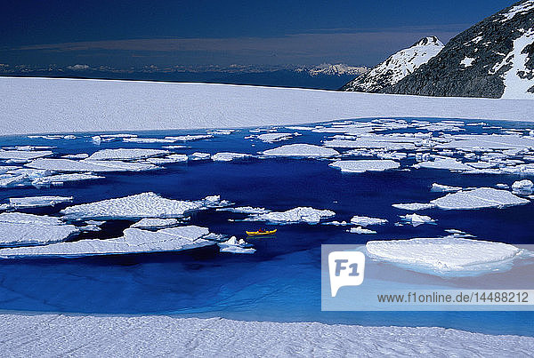 Woman Relaxing in Kayak Blue Melt Pond Juneau Icefield AK