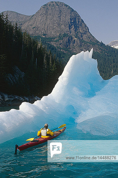 Sea Kayaker Approaches Iceberg Tracy Arm SE AK Summer Fords-Terror Wilderness Area