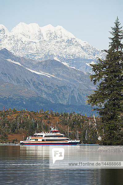 Tourists cruise by Esther Island on the Klondike Express sightseeing boat  Prince William Sound  Southcentral Alaska.