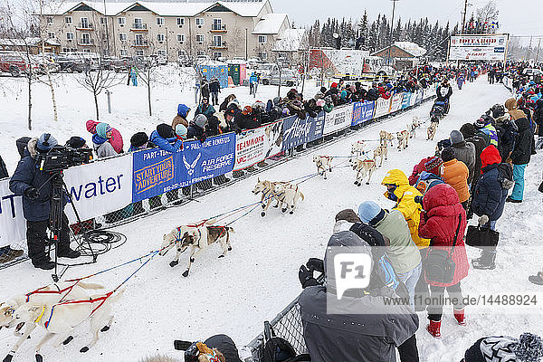 Jim Lanier runs down the start chute at the official start of the 2015 Iditarod in Fairbanks  Alaska.