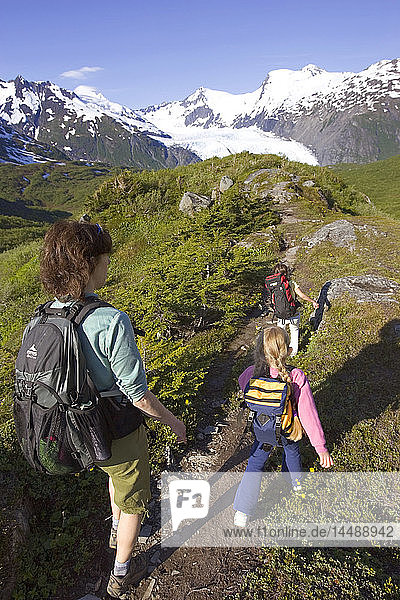 Mother & daughters hiking Portage Pass Trail towards Portage Glacier Chugach Mtns & Nat Forest Alaska
