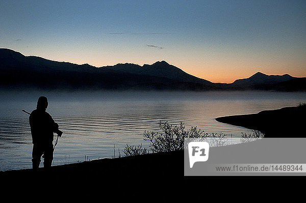 A deer hunter searches for game near Frazer Lake  Kodiak Island  Southwest Alaska