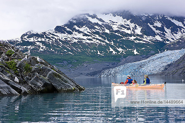 Family kayaking in Shoup Bay with Shoup Glacier in the background  Prince William Sound  Southcentral Alaska