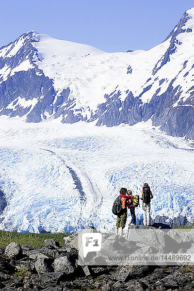 Family on hike over Portage Pass Trail stop to view Portage Glacier Chugach Nat Forest Alaska Summer