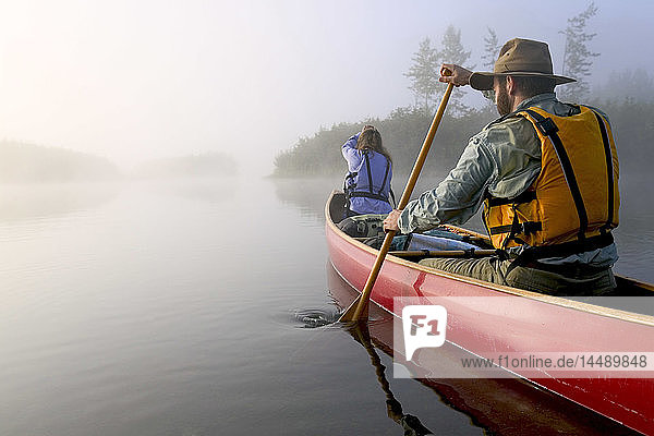 Couple Canoeing @ Sunrise on Lake Portage Valley SC AK Summer in Fog