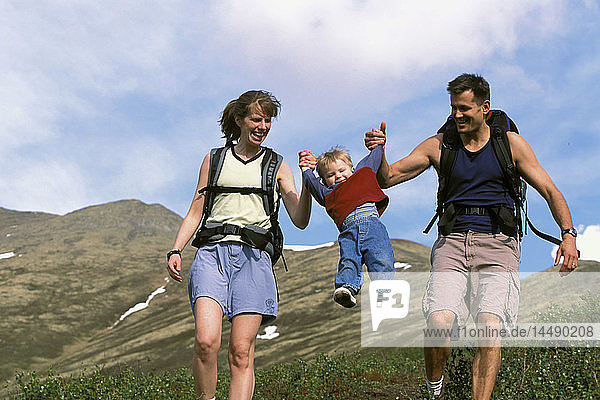 Man & Woman Hiking With Child Chugach State Park AK