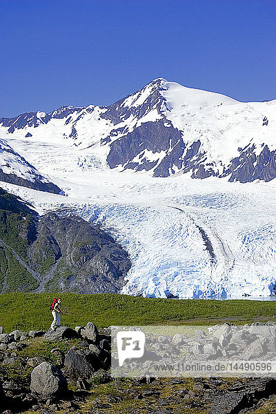Girl hiking over Portage Pass Trail Chugach Mtns w/Portage Glacier bckgrnd Chugach NF Alaska Summer