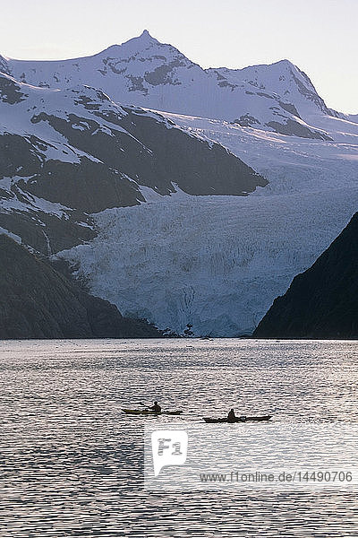Kayakers Silhouetted In Front Of Holgate Glacier Kenai Fjords Nat Park Kenai Peninsula Alaska Summer