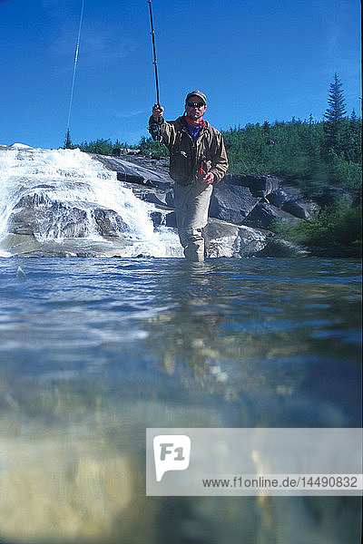 Man Fishing in Stream View Underwater PWS Alaska