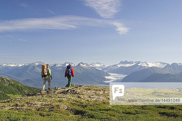 Couple hiking near Mendenhall Glacier Tongass National Forest Alaska Southeast