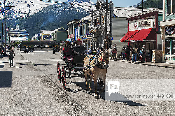 Visitors enjoy a buggy ride in Skagway  Alaska.