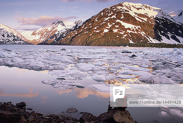 Hiker Sitting & View Portage Lake & Icebergs AK