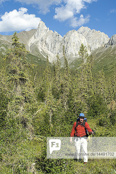 Man backpacking in the Brooks Range during Summer in Arctic Alaska
