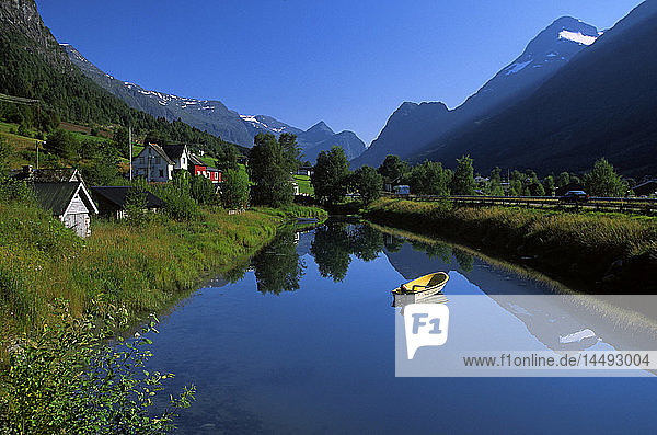 Rowing boat on lake in mountains