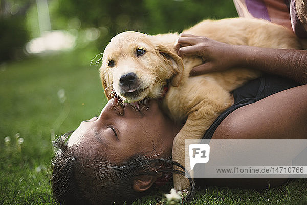 Woman playing with puppy