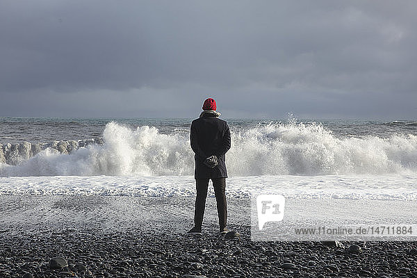 Person looking at sea waves