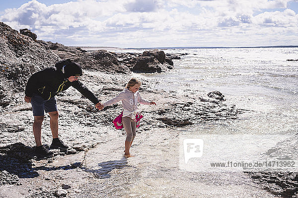 Mother with daughter on beach
