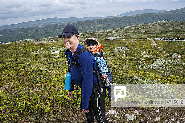 Mother hiking with baby boy