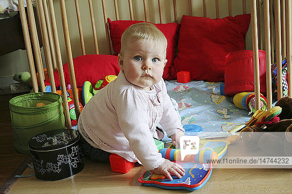 INFANT PLAYING INDOORS