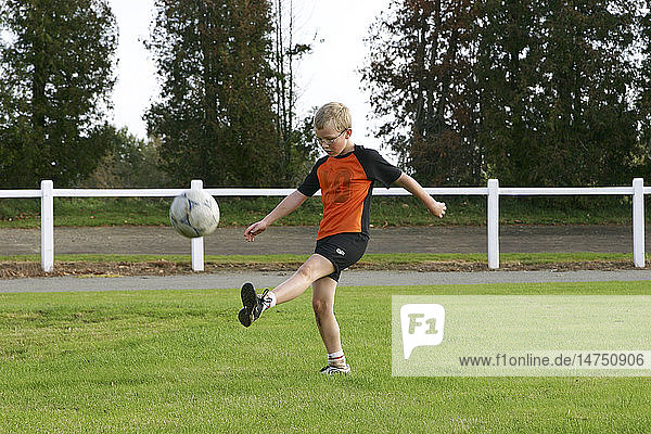 CHILD PLAYING A SPORT