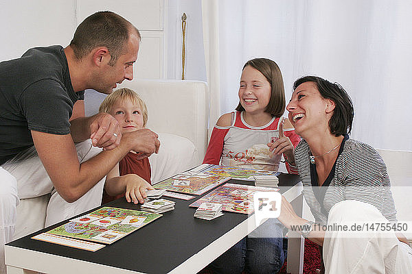 FAMILY PLAYING INDOORS