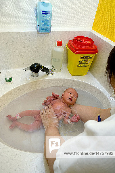NEWBORN BABY TAKING A BATH