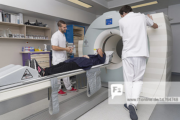 Reportage on PET imaging at the Antoine-Lacassagne Cancer centre in Nice  France. Positron Emission Tomography  or PET scan  is used in diagnosing and monitoring patients with cancer. This method enables tumours to be detected using a radioactive tracer  which accumulates heavily in cells that present a pathological hypermetabolism.