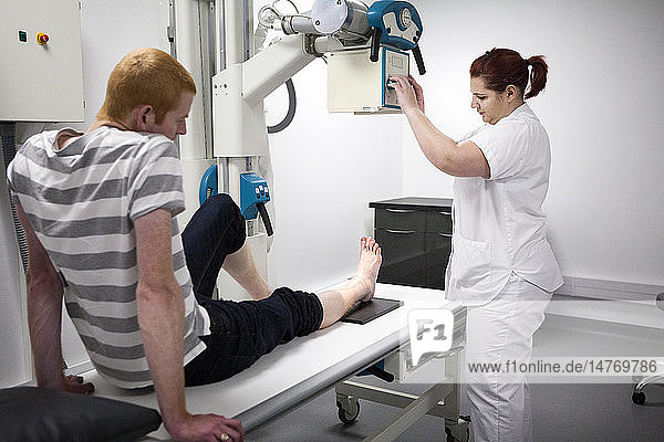 Reportage on a mountain rescue doctor working in both the Carroz and de Flaine ski resorts in Haute-Savoie France. He treats skiers and snowboarders who have been injured on the slopes. A patient sees the doctor following a fall in the resort. A nurse x-rays his ankle.