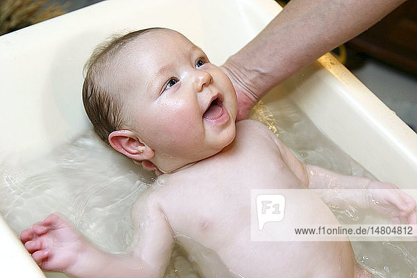 INFANT TAKING A BATH