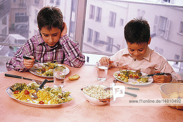 CHILD EATING RAW VEGETABLES