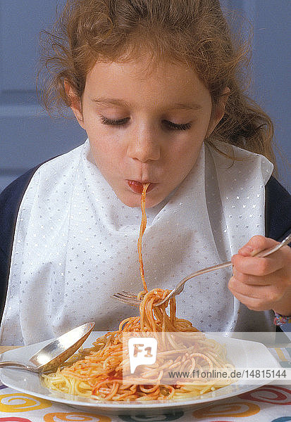 CHILD EATING STARCHY FOOD
