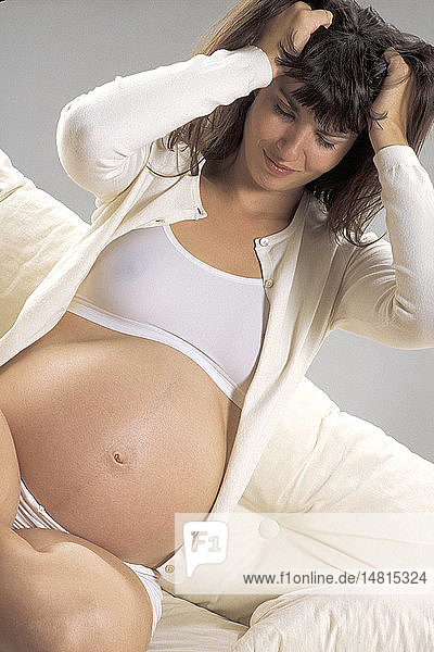 PREGNANT WOMAN IN PAIN  INDOORS