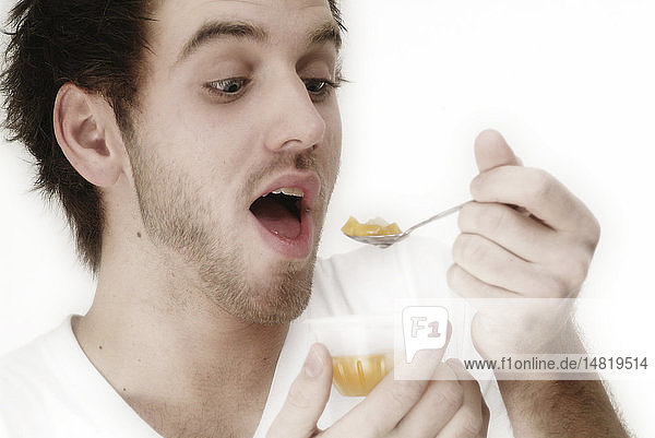 MAN EATING FRUIT