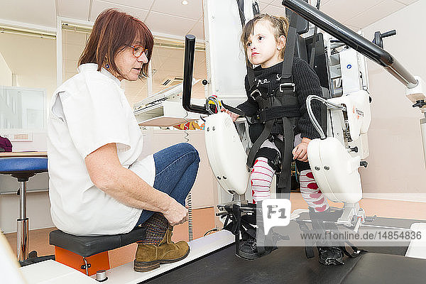 Reportage on the Rossetti health centre in Nice France. This rehabilitation centre is a hub of excellence with cutting-edge technology. The Rossetti Motor Function Education Institute is the first French establishment to have a pediatric Lokomat PRO V6 an automated walking orthosis enabling intensive walking rehabilitation on a treadmill. This 4-year old girl suffers from neurological disorders and is late walking. She is having a training session with a physiotherapist.