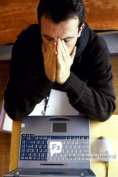 MAN WITH HEADACHE