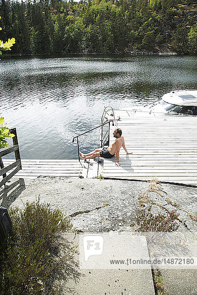 Man relaxing on jetty