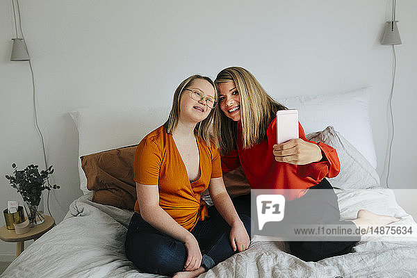 young woman with down syndrome hanging out with girlfriend