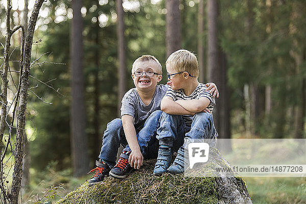 Boys posing in forest